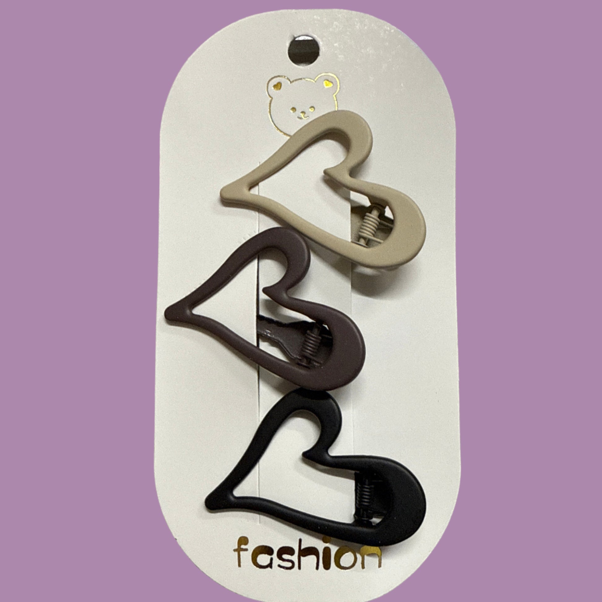 Heart-shaped hair clips on a white card with 'fashion' branding against a gray background